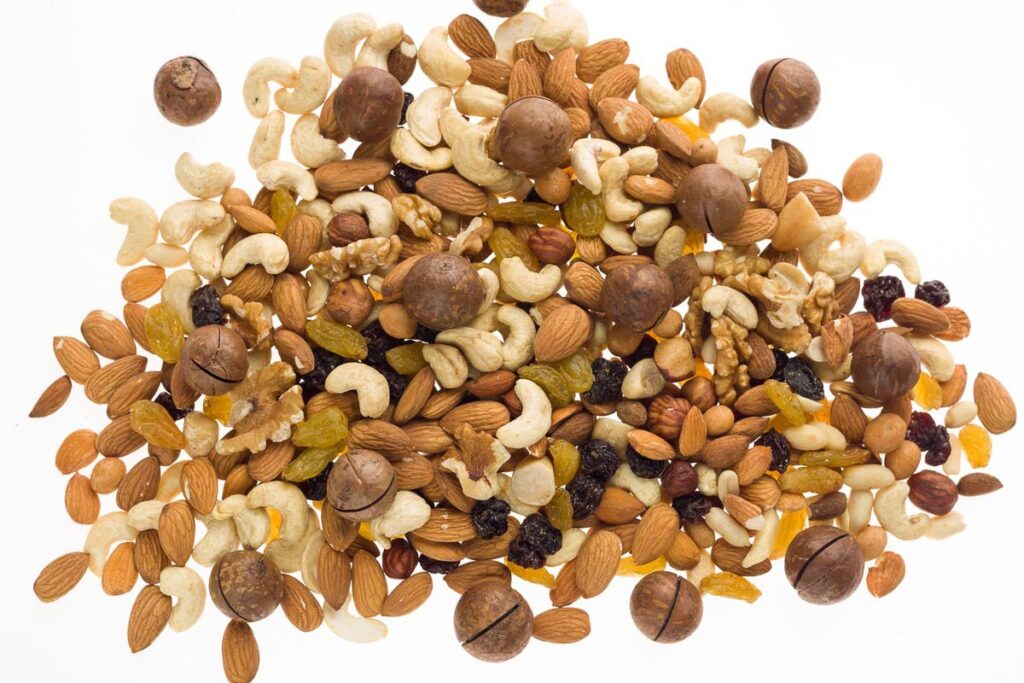 Mix of nuts and dried fruits. Cashew, almonds, macadamia, hazelnuts, Brazilian, walnuts, raisins, peanuts.