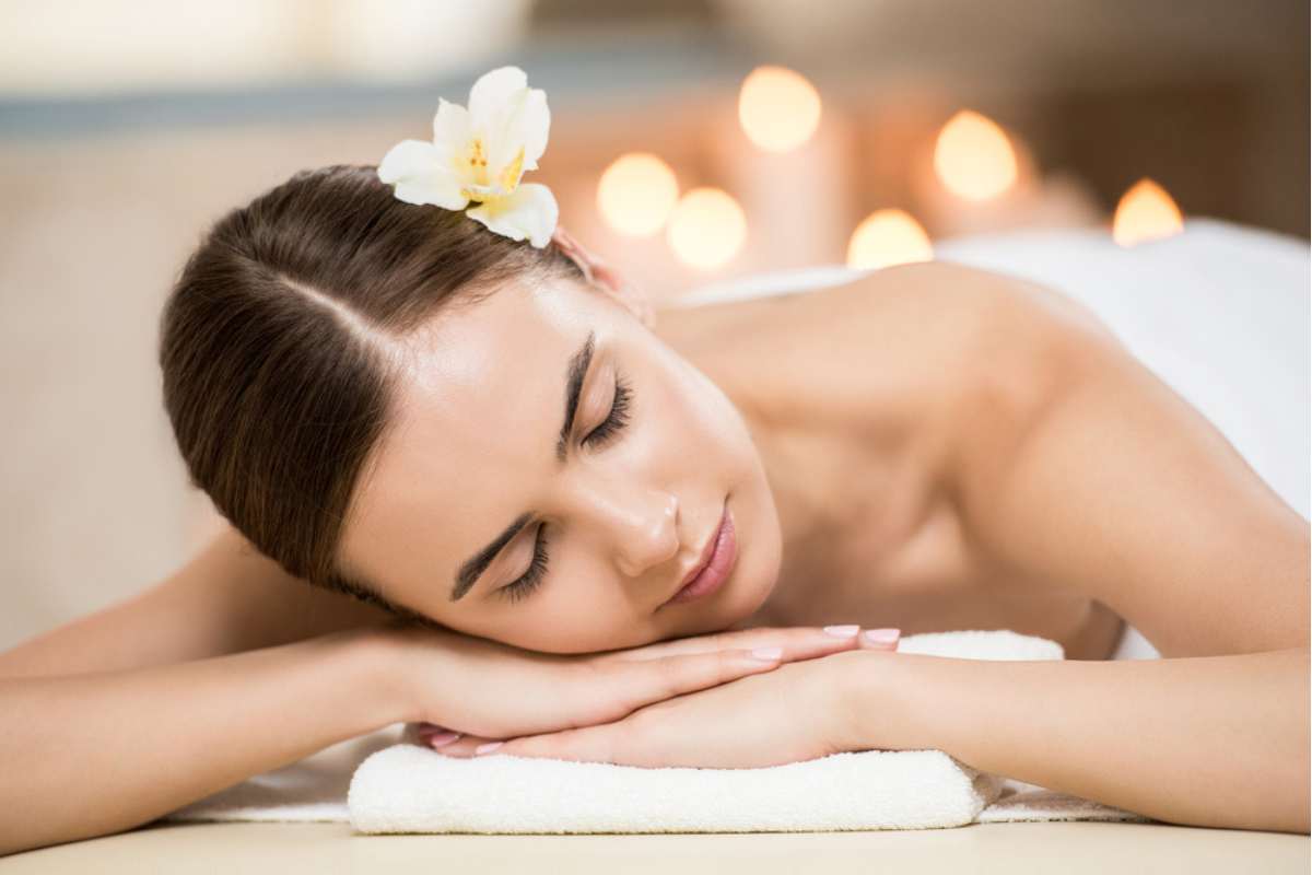 Woman relaxing in spa salon.