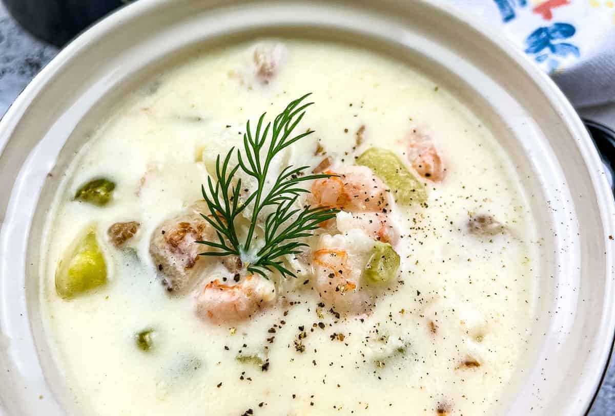 Seafood chowder with a sprig of dill, a delicious soup recipe.