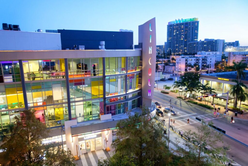 Photo of Lincoln Road Mall and cityscape at sunset.
