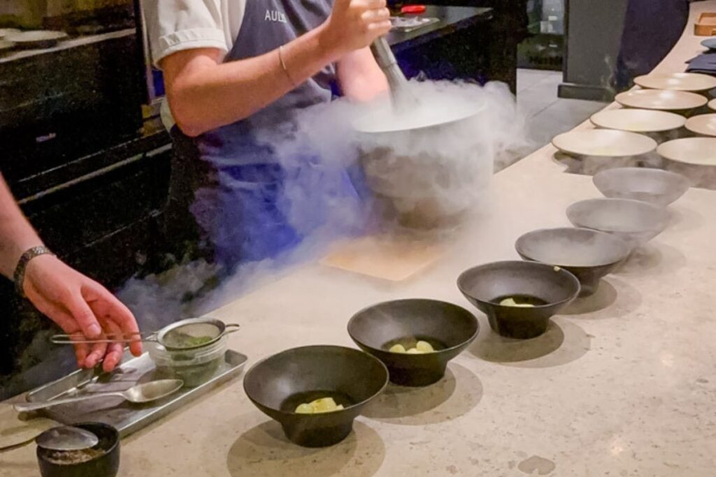 Photo of crew in Aulis preparing dishes.
