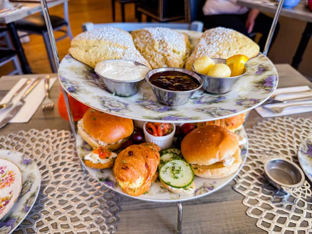 A layered presentation of sweets and pies in Maddie Hatter Tea Shop.