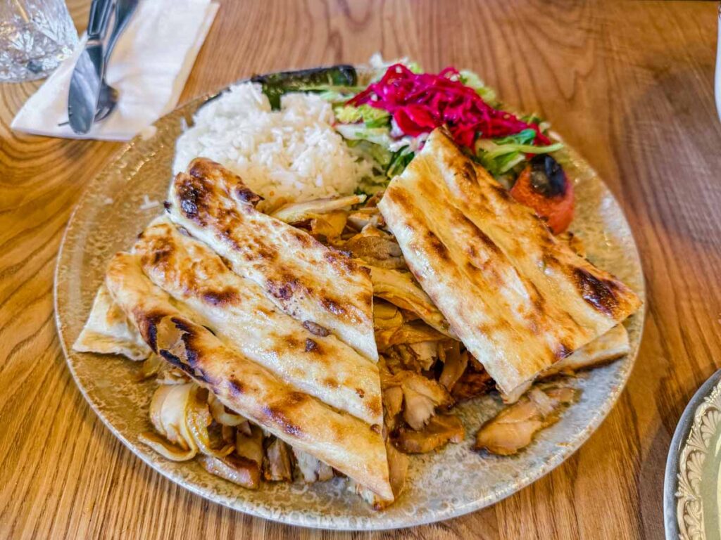 Food in a round plate at Mama Fatma's Turkish Restaurant.