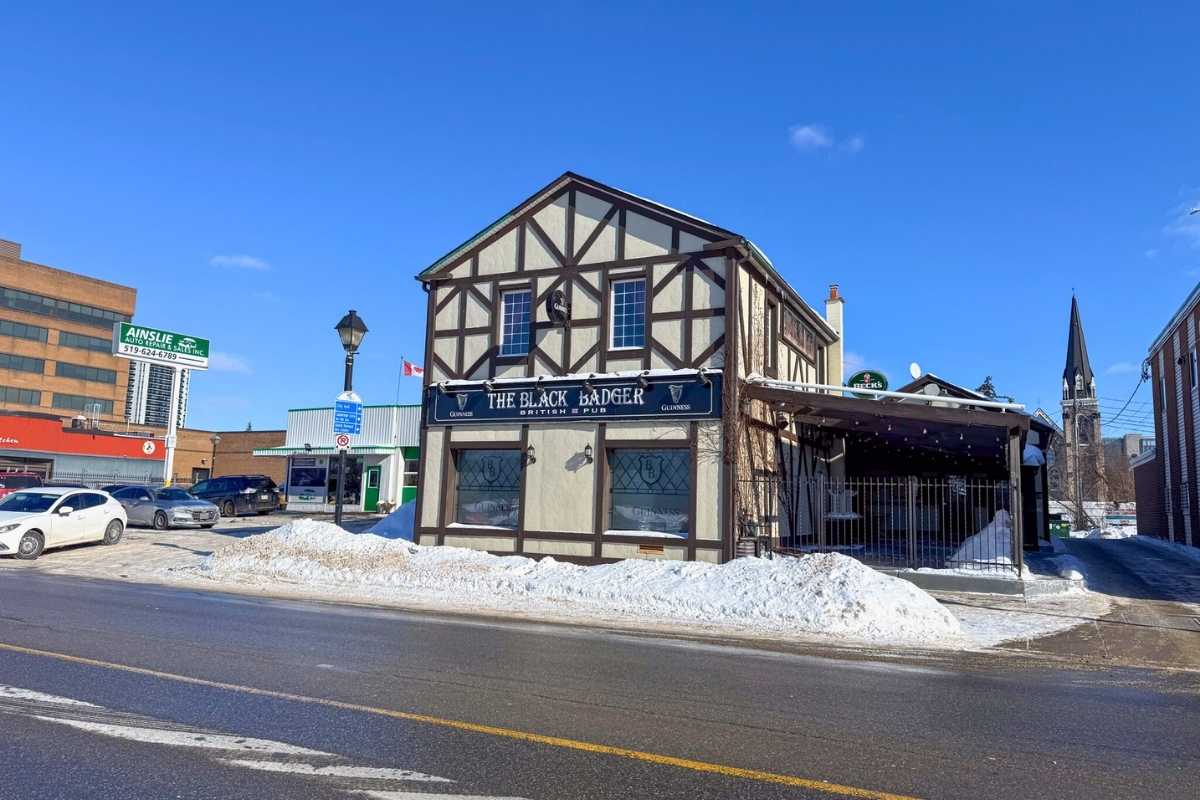 The Black Badger building exterior, seen from the street, with clear view of entrance and signage.