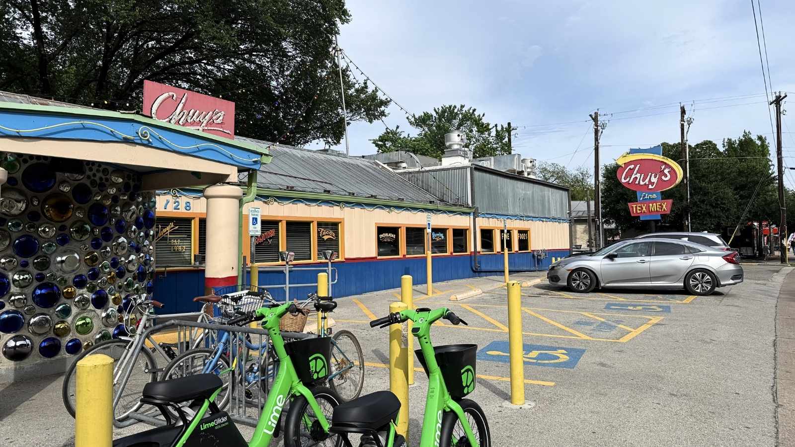 A horizontal image of the exterior of Chuy's Tex-Mex restaurant with a parking lot in front.